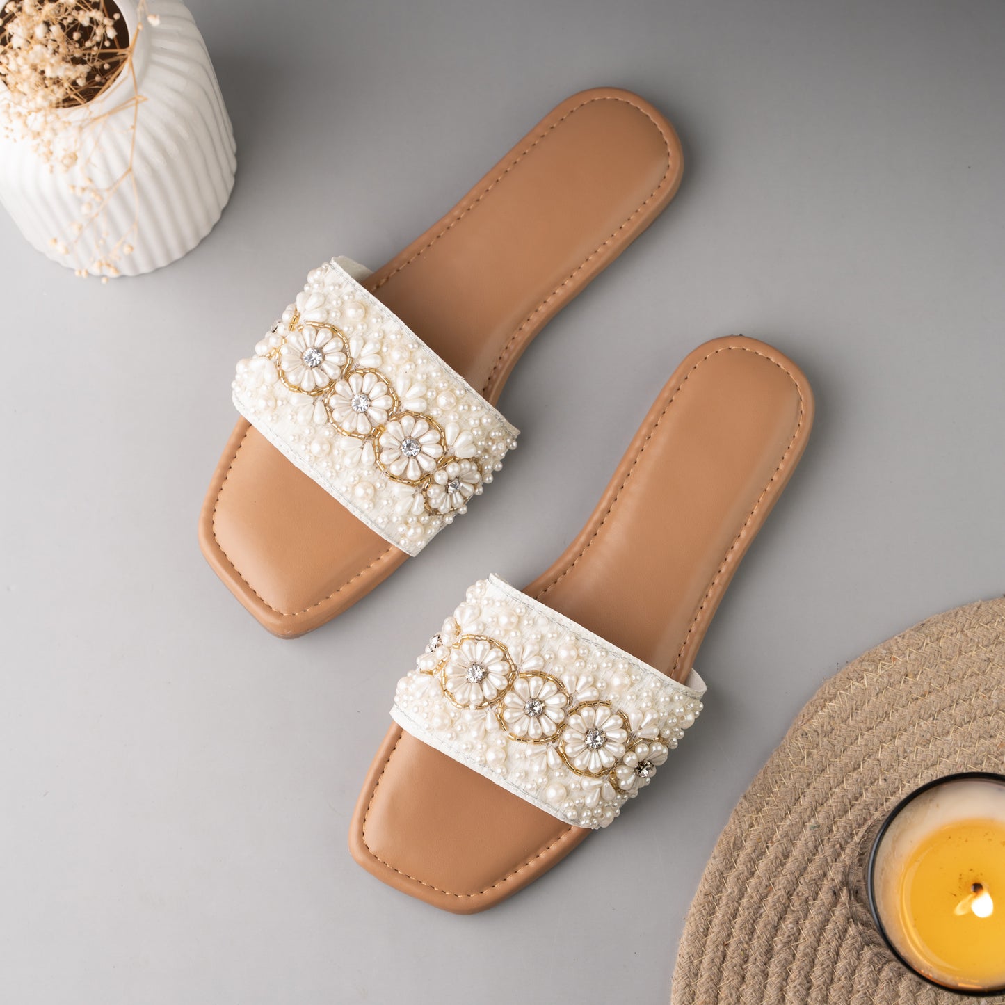 Tan flat sliders with handcrafted pearl flowers and gold thread detail