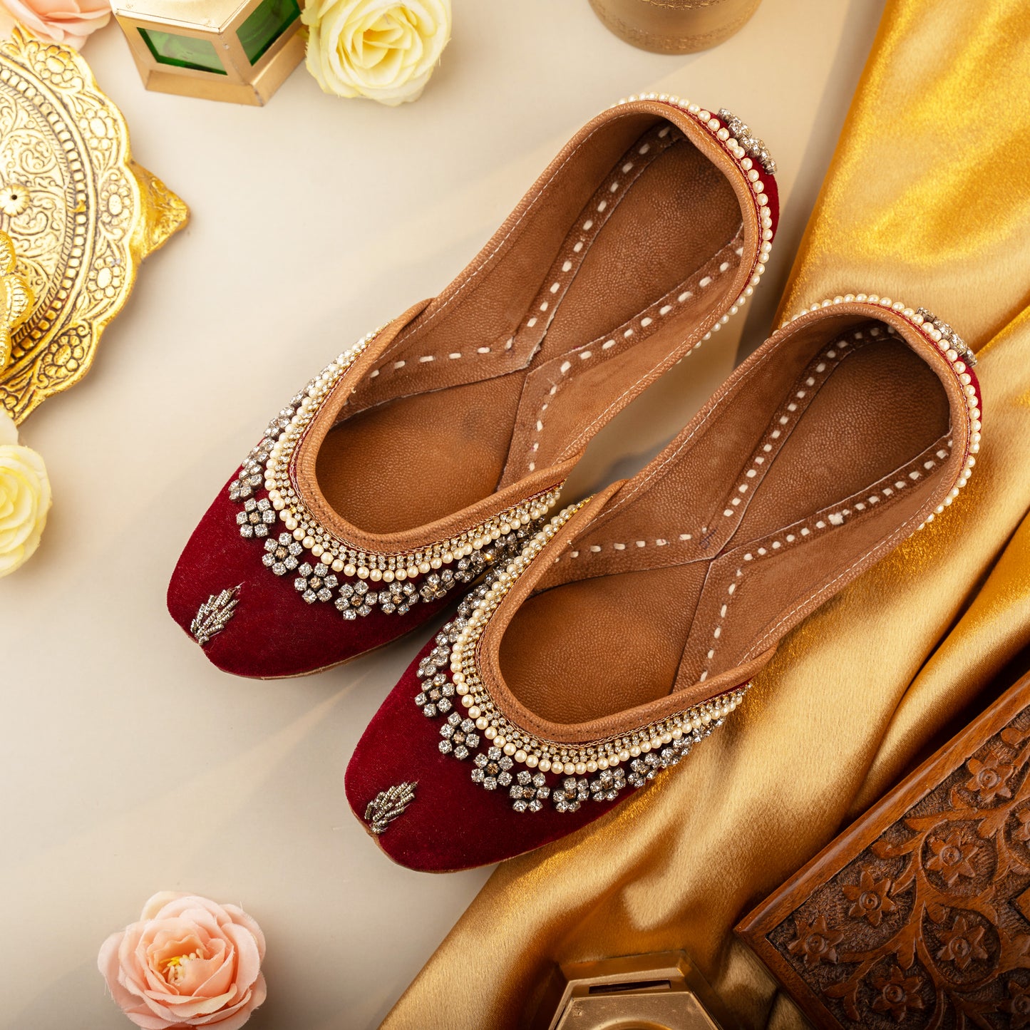 Red velvet bridal juttis for women, handcrafted with intricate wedding embroidery for elegance and comfort, perfect for brides and festive occasions