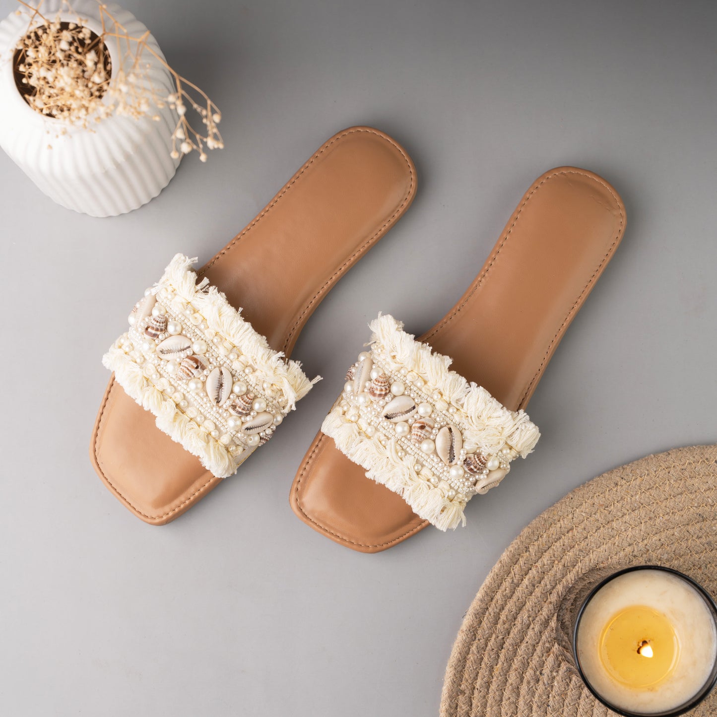 Comfortable white sliders designed with a relaxed boho aesthetic
