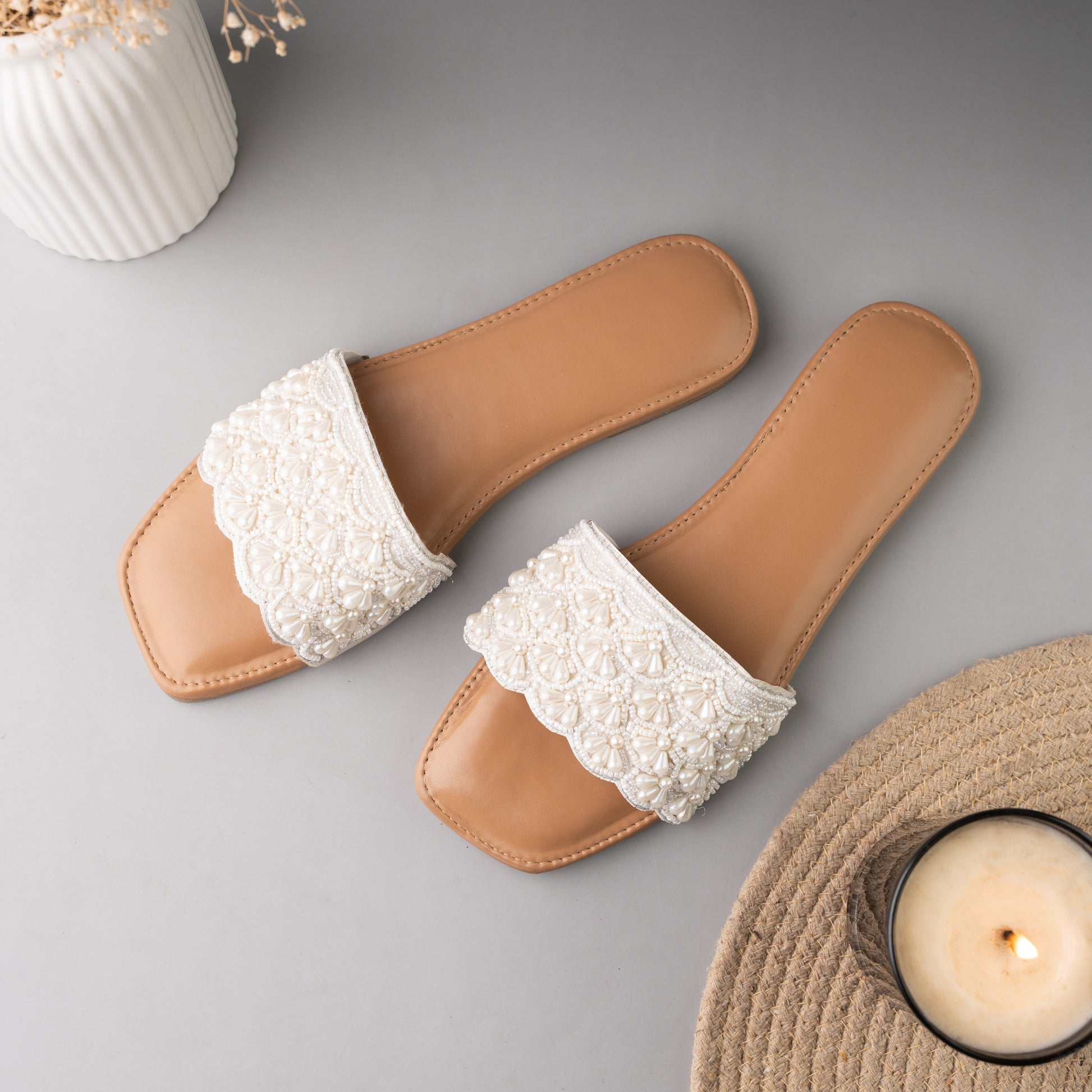 Beige slip-on sandals with square toe and textured white strap for a chic look
